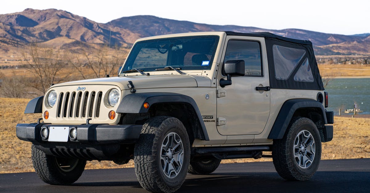 In Mongolia, what kind of vehicle is a jeep? - White Jeep Wrangler on Road In Mongolia, what kind of vehicle is a jeep? - White Jeep Wrangler on Road