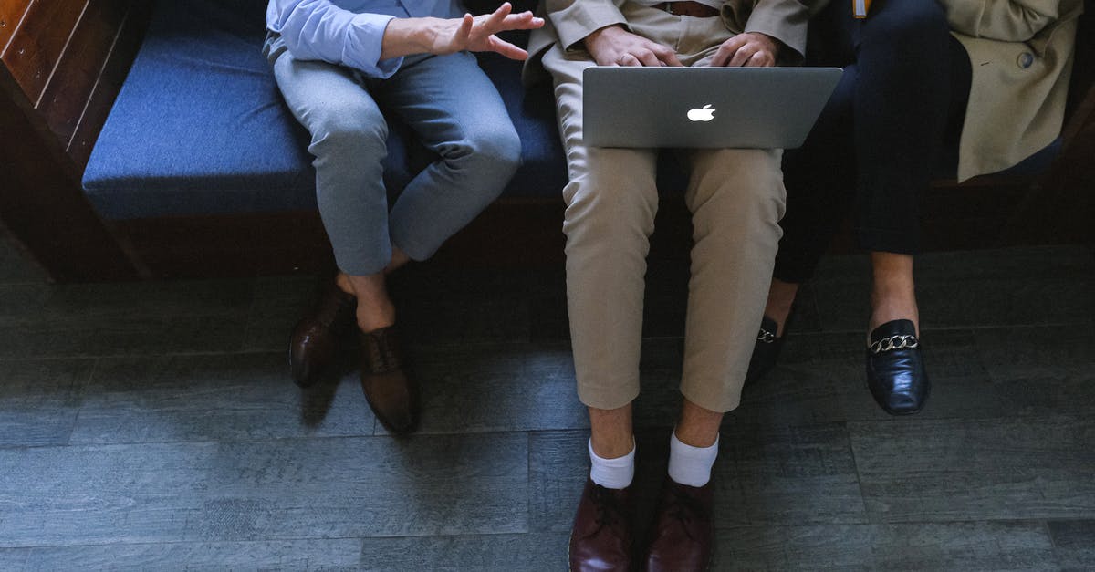 In Singapore, how much does an average person use a car? [closed] - Man in Blue Dress Shirt and Gray Pants Sitting on Blue Couch