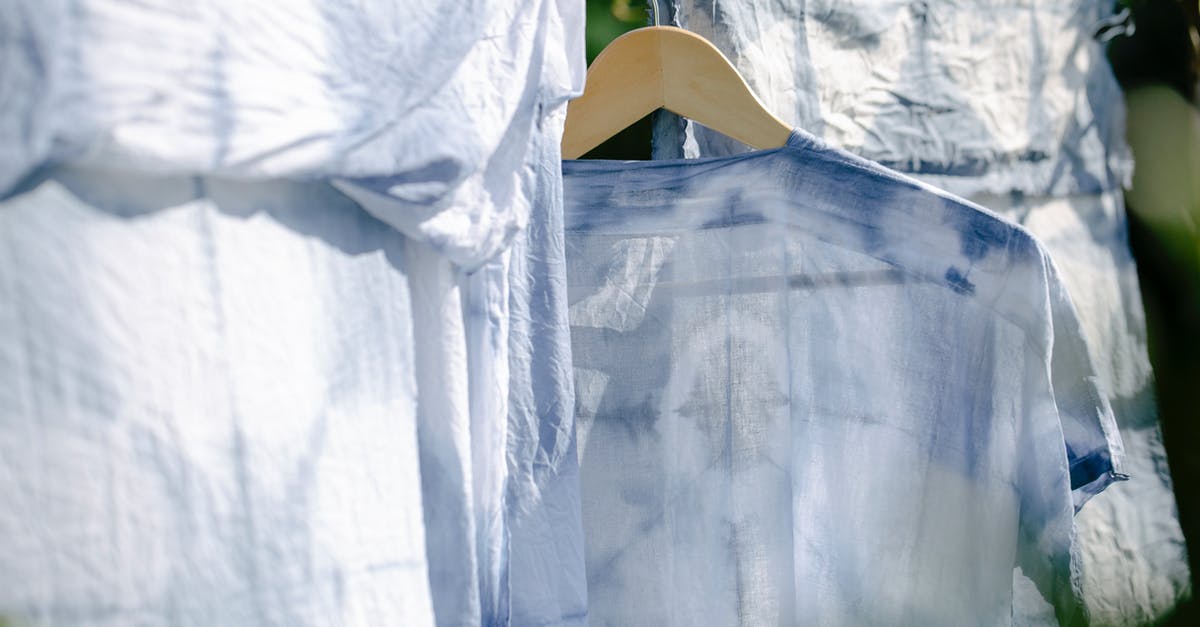 In the context of air travel, are layovers different to stopovers? - Collection of various washed clothes hanging on rope on fresh air on sunny day in summer In the context of air travel, are layovers different to stopovers? - Collection of various washed clothes hanging on rope on fresh air on sunny day in summer