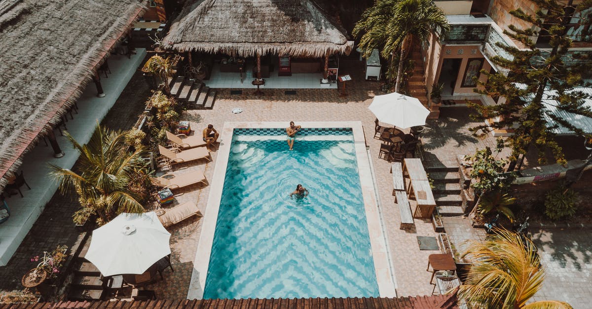 In the context of hotels, what's a "purser"? - Aerial Photography of Three People in a Swimming Pool In the context of hotels, what's a "purser"? - Aerial Photography of Three People in a Swimming Pool