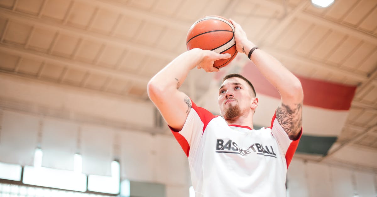 In the Italo high-speed train, what is the difference between club seat and "salotto"? - From below of concentrated basketball player with tattoos on arms preparing throwing ball to hoop In the Italo high-speed train, what is the difference between club seat and "salotto"? - From below of concentrated basketball player with tattoos on arms preparing throwing ball to hoop
