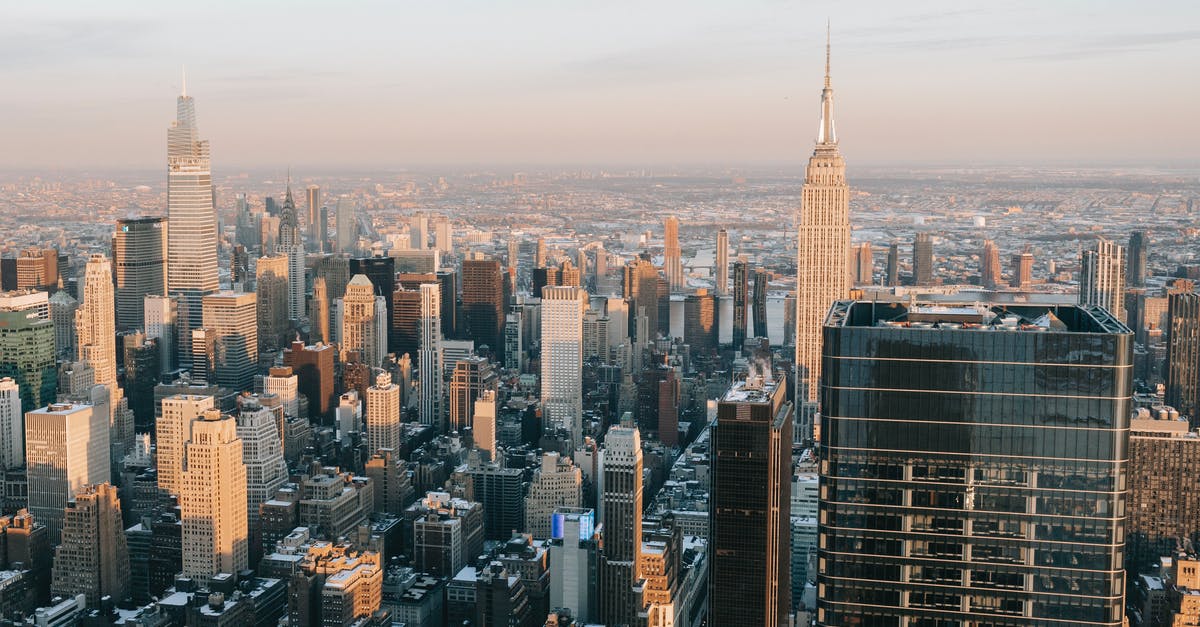 In the US customs declaration form, is H1 B visa holder resident or visitor - Tall skyscrapers located in modern financial district In the US customs declaration form, is H1 B visa holder resident or visitor - Tall skyscrapers located in modern financial district