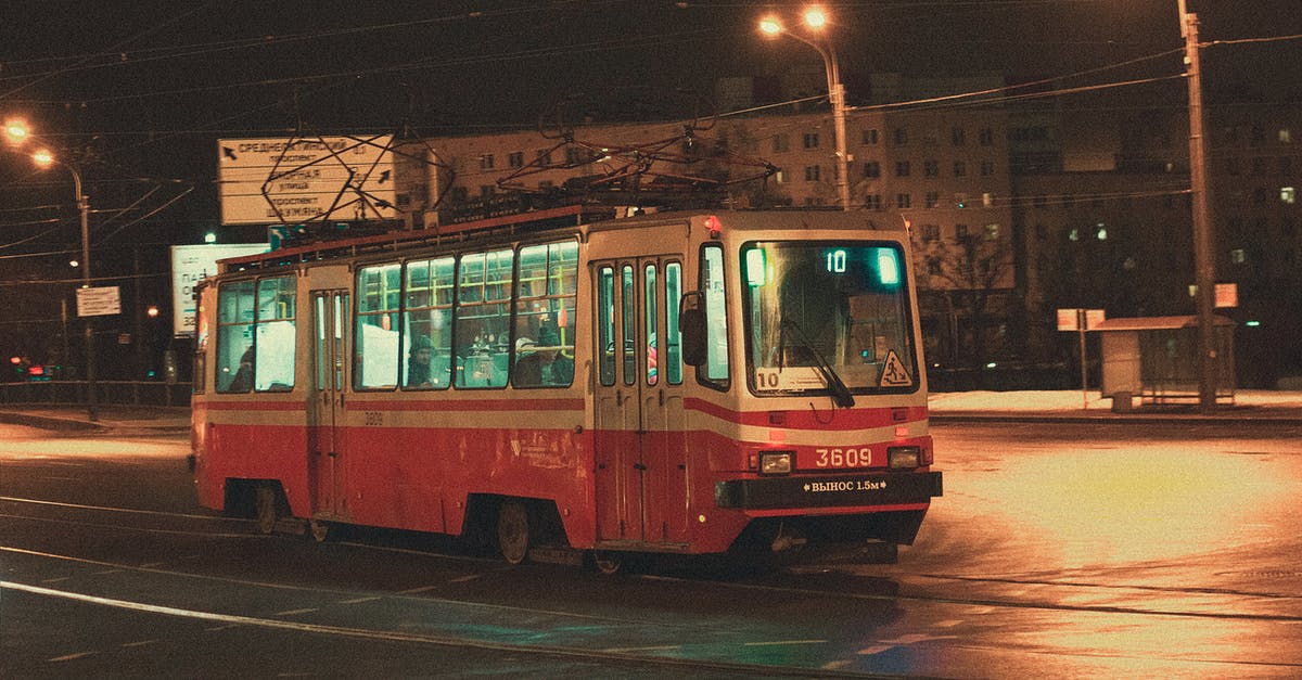 In what city is this bus (tram?) located? - Red Bus In what city is this bus (tram?) located? - Red Bus