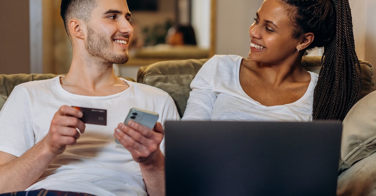 In which bag laptop charger and laptop battery can be taken? And in which bag food can be taken? [closed] - Man in White Tank Top Holding White Smartphone