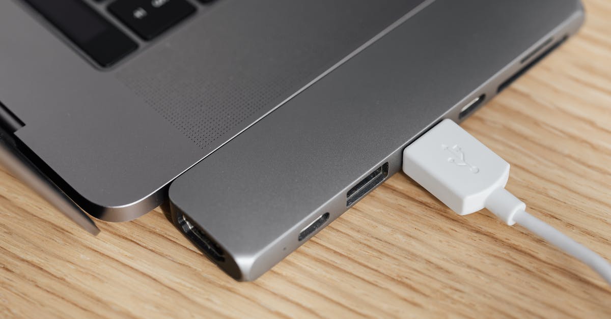 In which countries Electronic items purchased from India can be used without any voltage converter and vice versa? [closed] - Gray laptop with connected USB multiport station
