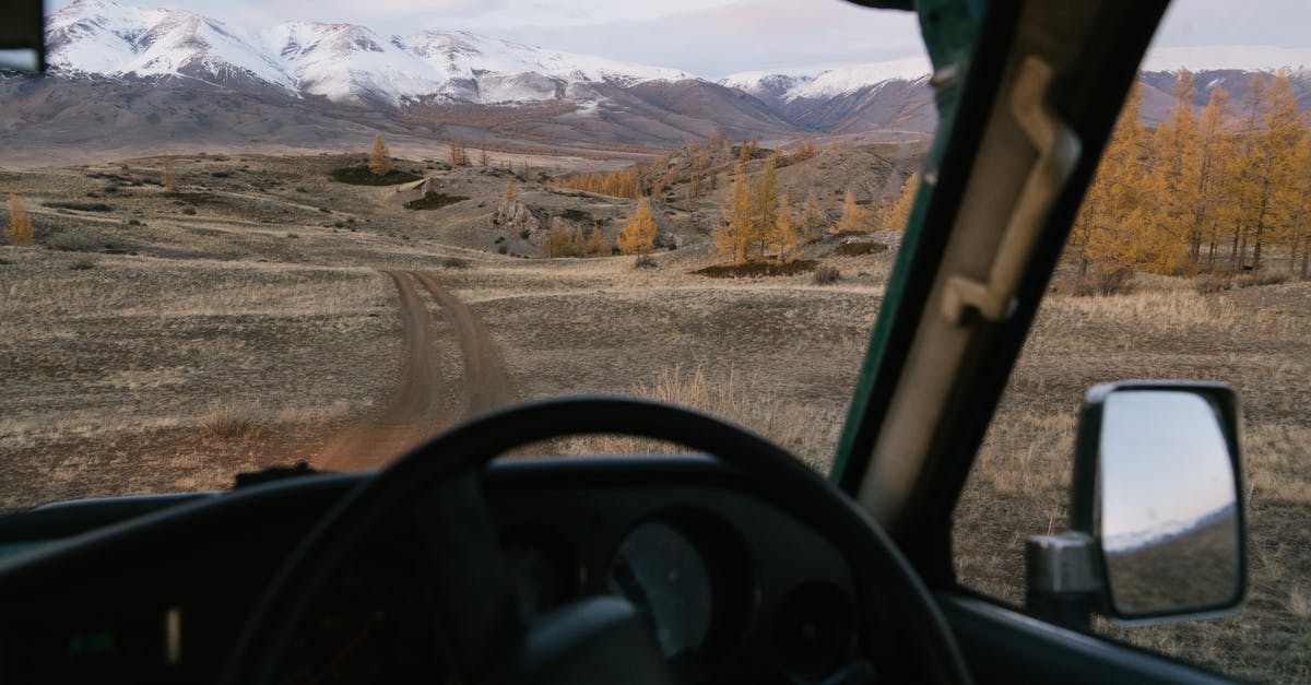 In which country do you pay tax and duty when travelling through multiple countries? - Empty road going through prairie to mountains viewed from car in countryside travel through Mongolia In which country do you pay tax and duty when travelling through multiple countries? - Empty road going through prairie to mountains viewed from car in countryside travel through Mongolia