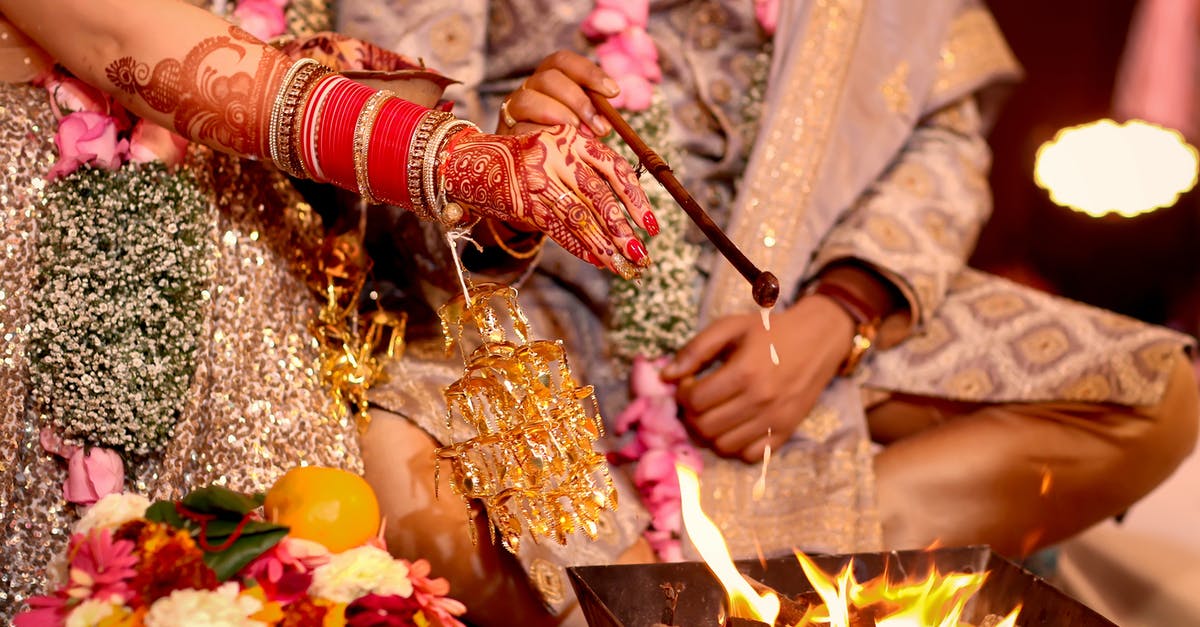 India Visa after marriage - Person Holding Stick With Candles India Visa after marriage - Person Holding Stick With Candles