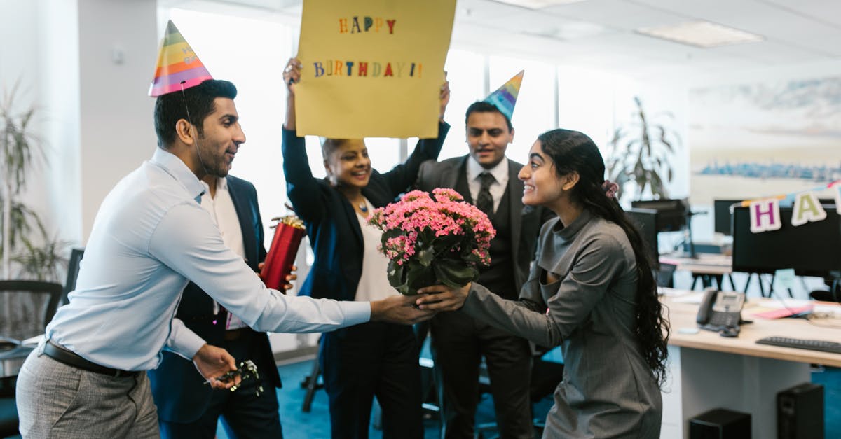Indian e-visa: where is the immigration office located on Delhi airport? - Man Giving a Woman Flowers