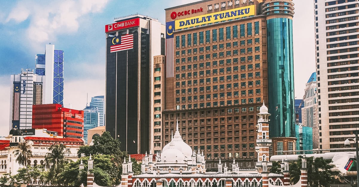 Indian National lost passport in Malaysia - Jamek Mosque and big multi storey buildings Indian National lost passport in Malaysia - Jamek Mosque and big multi storey buildings