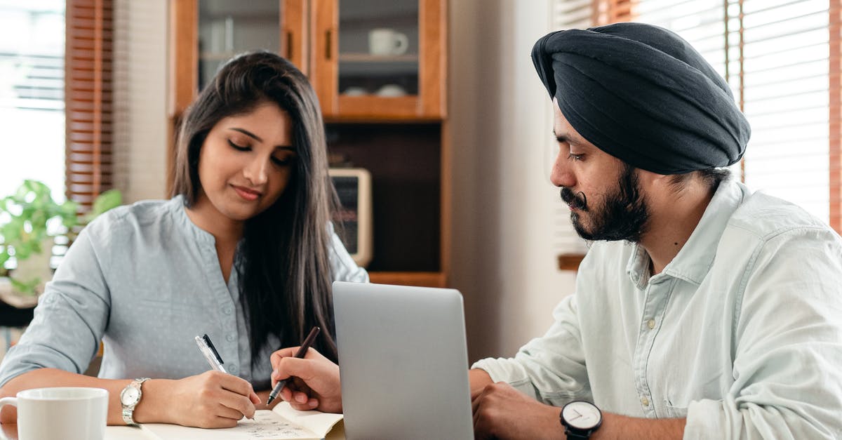 Indian on H1B visa, traveling to Europe. Schengen visa question - Focused tutor and student doing homework assignment using laptop Indian on H1B visa, traveling to Europe. Schengen visa question - Focused tutor and student doing homework assignment using laptop