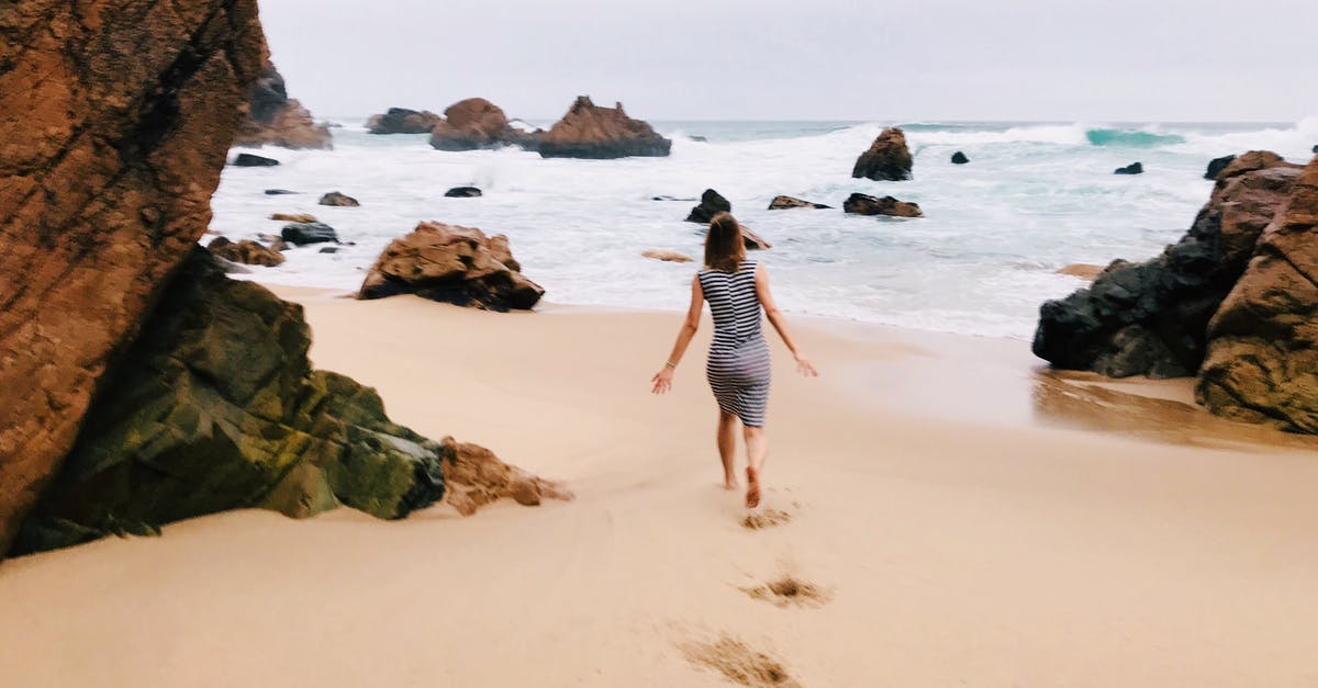 Indian passport holder living in Scotland, travelling to portugal for vacations - Photo of Woman Walking on Seashore Indian passport holder living in Scotland, travelling to portugal for vacations - Photo of Woman Walking on Seashore