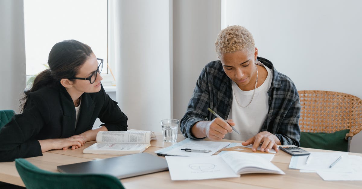 Indian Student in France on Long Stay Study Visa. Can I travel to or enter Italy? [duplicate] - A Woman in Black Blazer Teaching Her Student in Plaid Long Sleeves