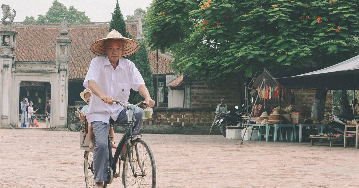 Indian travelling by road through Cambodia, Laos and Vietnam - Man Riding Bike Indian travelling by road through Cambodia, Laos and Vietnam - Man Riding Bike