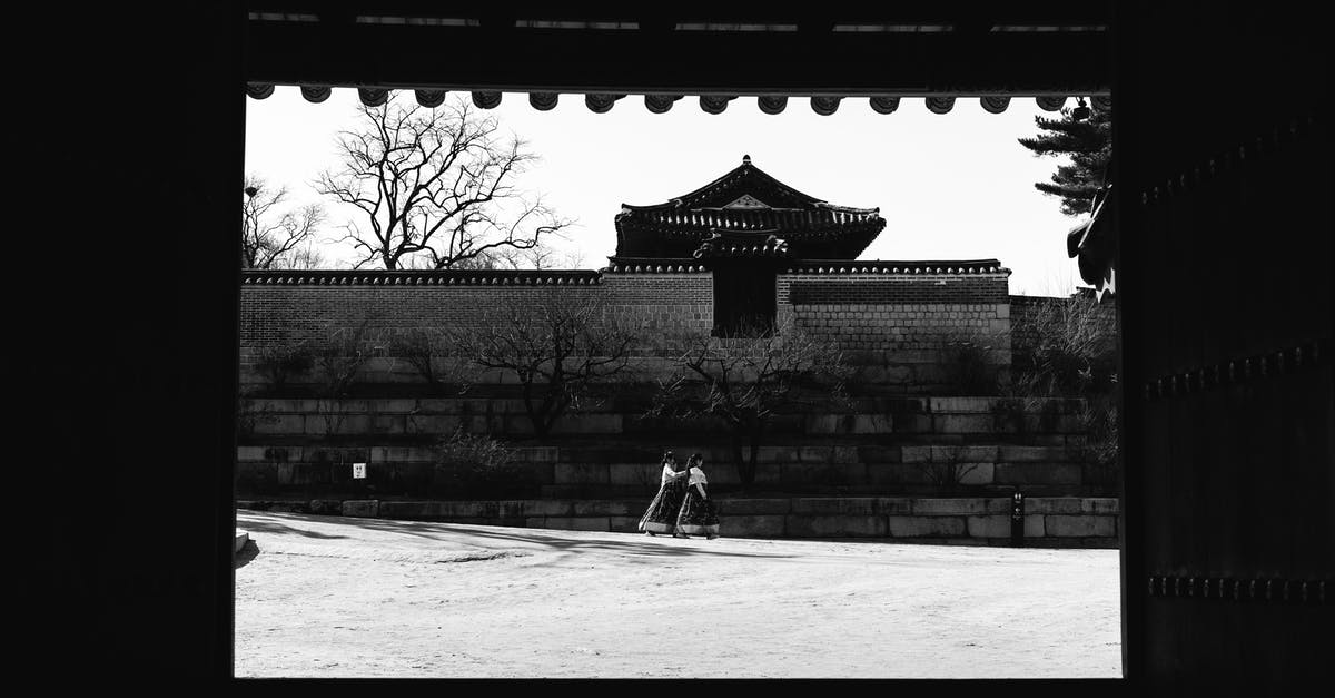 Indonesian with Japan visa travelling to South Korea - Grayscale Photo of Man in Black Jacket and Pants Sitting on Bench Indonesian with Japan visa travelling to South Korea - Grayscale Photo of Man in Black Jacket and Pants Sitting on Bench