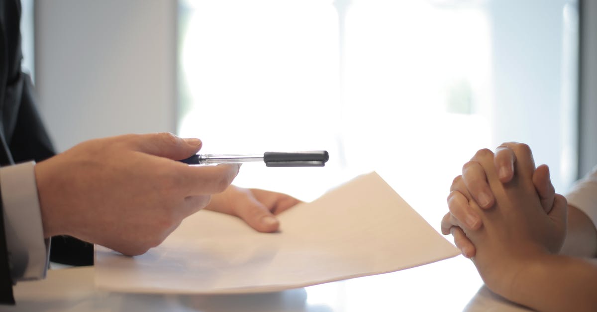Insurance against airline bankruptcy - Crop businessman giving contract to woman to sign Insurance against airline bankruptcy - Crop businessman giving contract to woman to sign