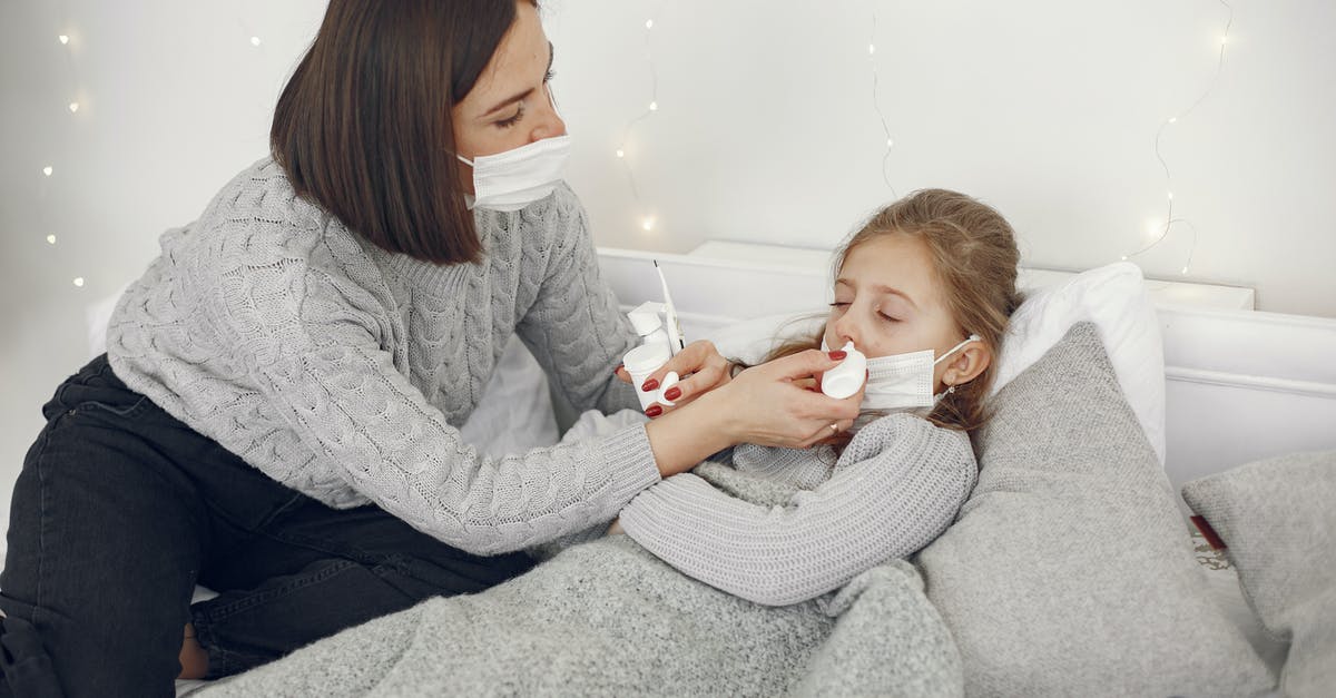Insurance claim for cancelled trip due to sickness - Woman in Gray Sweater Carrying Baby Insurance claim for cancelled trip due to sickness - Woman in Gray Sweater Carrying Baby