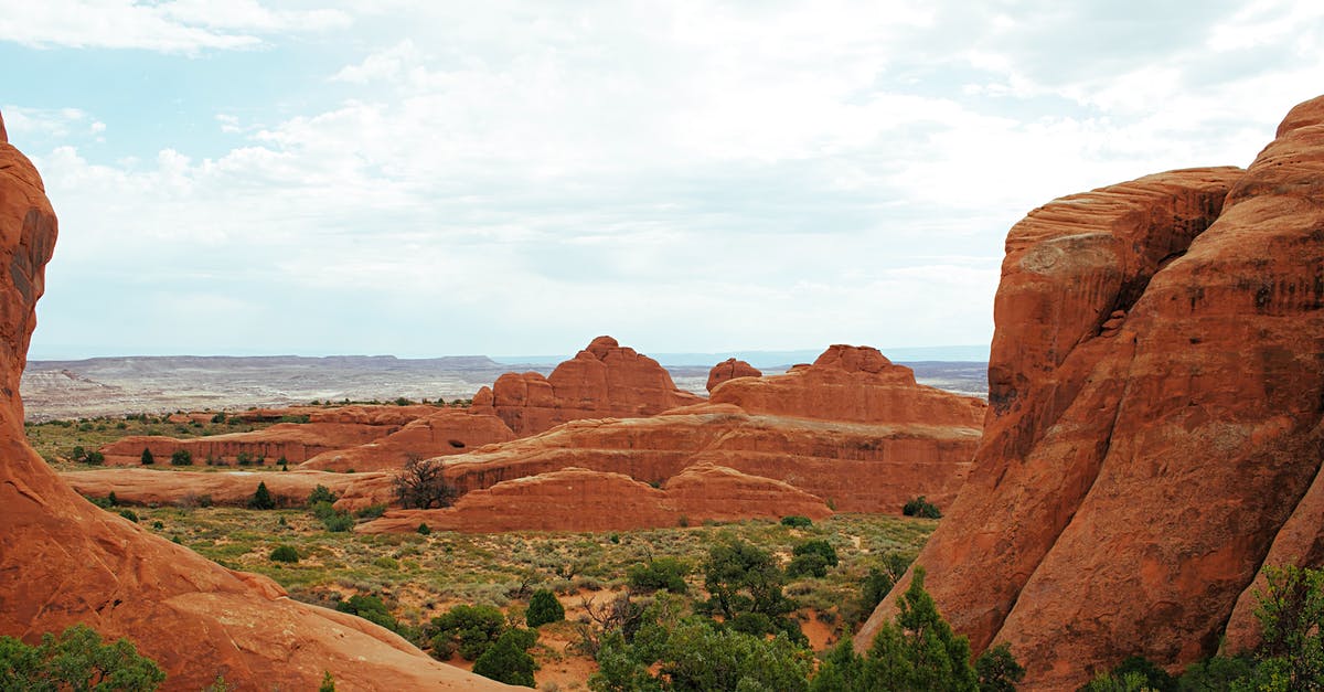Insurance for travel to the USA while pregnant - Brown Rock Formation Near Green Trees Insurance for travel to the USA while pregnant - Brown Rock Formation Near Green Trees