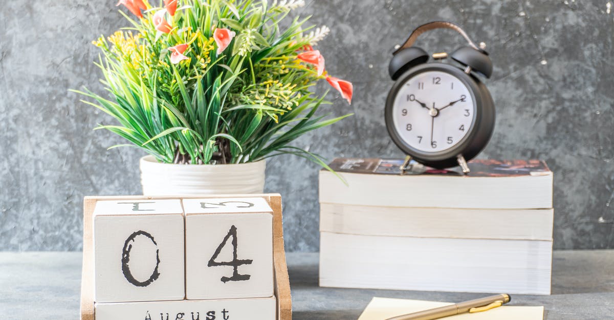 Intended day of arrival after course start date - UK Tier 4 General Student [closed] - Close-Up Shot of a Black Alarm Clock beside a Calendar
