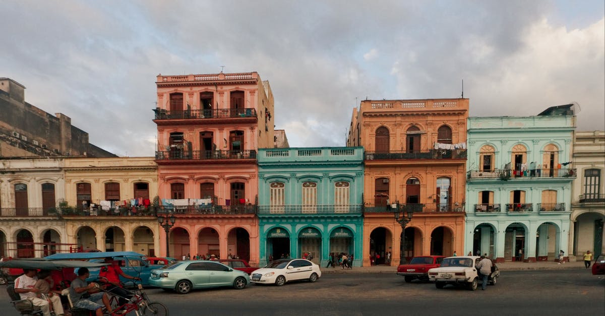 Intercity transportation in Cuba - Cars Parked Near Buildings Intercity transportation in Cuba - Cars Parked Near Buildings