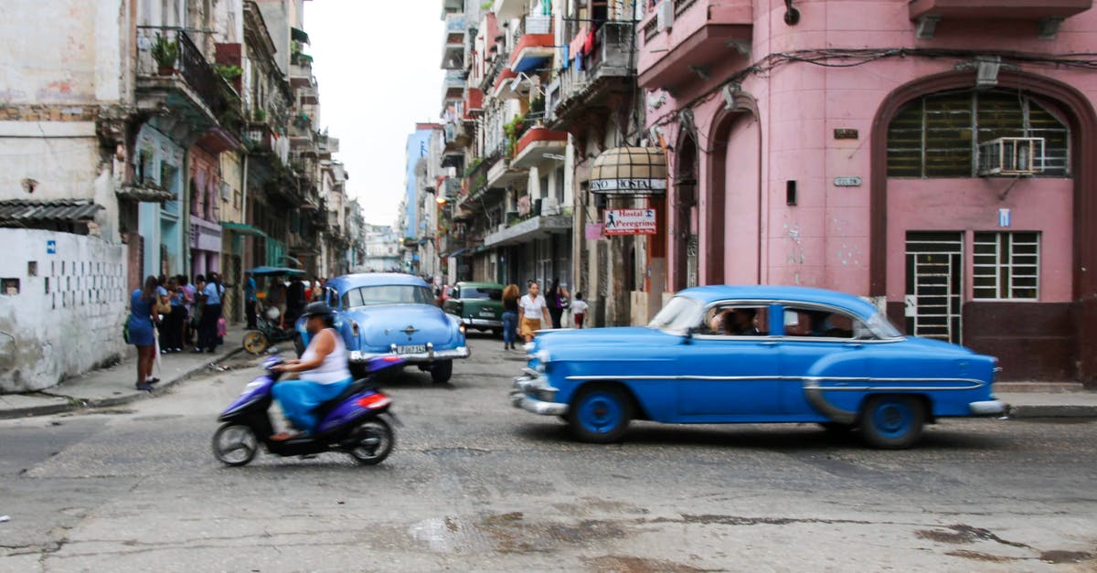 Intercity transportation in Cuba - Blue Sedan Parked Beside Blue Sedan on Street Intercity transportation in Cuba - Blue Sedan Parked Beside Blue Sedan on Street