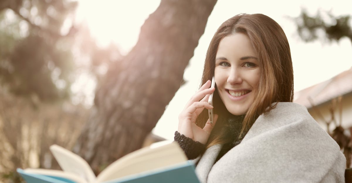 International calling and data connectivity - Woman in Gray Sweater Sitting Under the Three Trunks International calling and data connectivity - Woman in Gray Sweater Sitting Under the Three Trunks