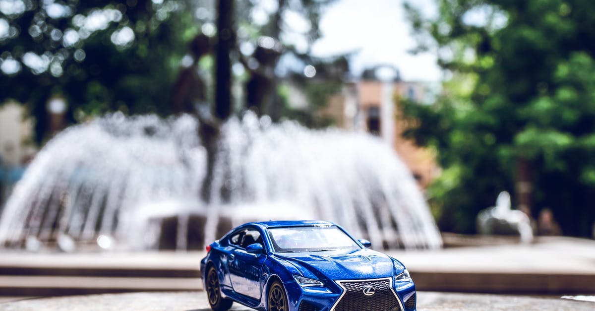 International drivers license in Scotland - Blue Die-cast Toy Car Across Outdoor Fountain