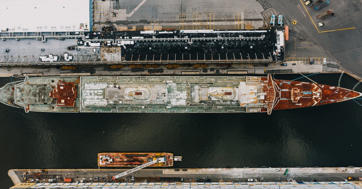 Is 1hr 25mins long enough to go through international layover processes in the USA? - Drone view of long ship moored on water of river near pier in daytime Is 1hr 25mins long enough to go through international layover processes in the USA? - Drone view of long ship moored on water of river near pier in daytime
