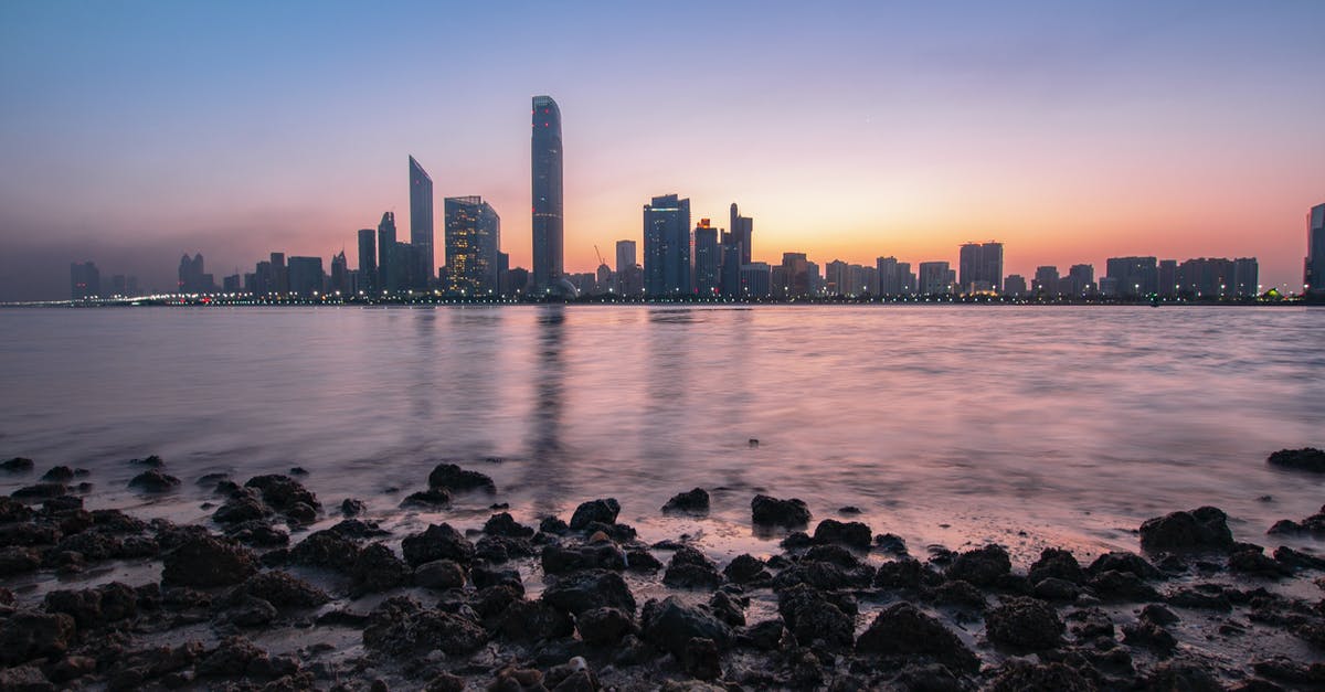 Is 7.5 hours between flights in Abu Dhabi enough to visit the city? - Skyscrapers Near Body of Water
