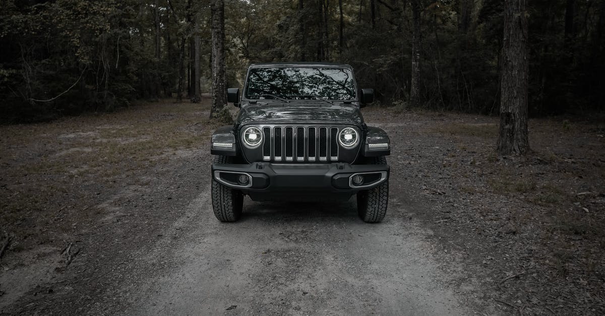 Is a 4WD required in practice to drive up Mauna Kea on Hawaii? - Black Jeep Wrangler on Dirt Road Surrounded by Trees Is a 4WD required in practice to drive up Mauna Kea on Hawaii? - Black Jeep Wrangler on Dirt Road Surrounded by Trees
