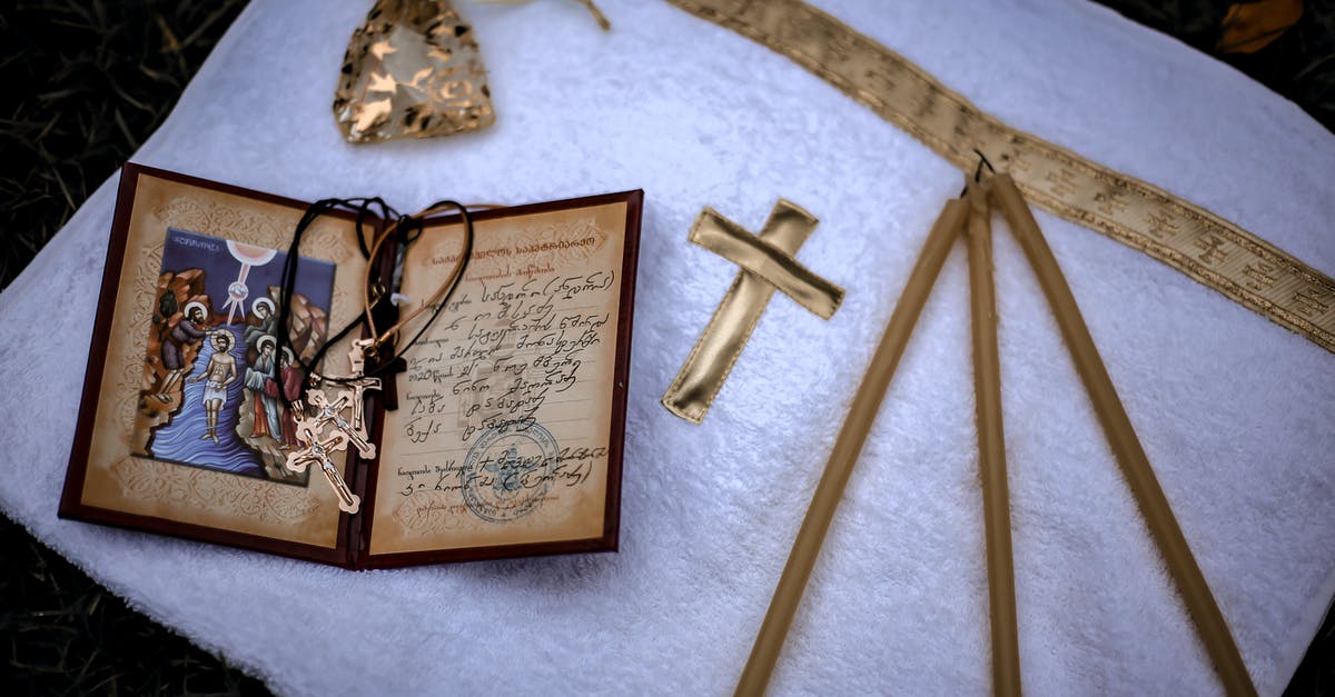 Is a birth certificate accepted when entering the UK? - From above of white towel with golden cross and candles with birth certificate and crosses Is a birth certificate accepted when entering the UK? - From above of white towel with golden cross and candles with birth certificate and crosses