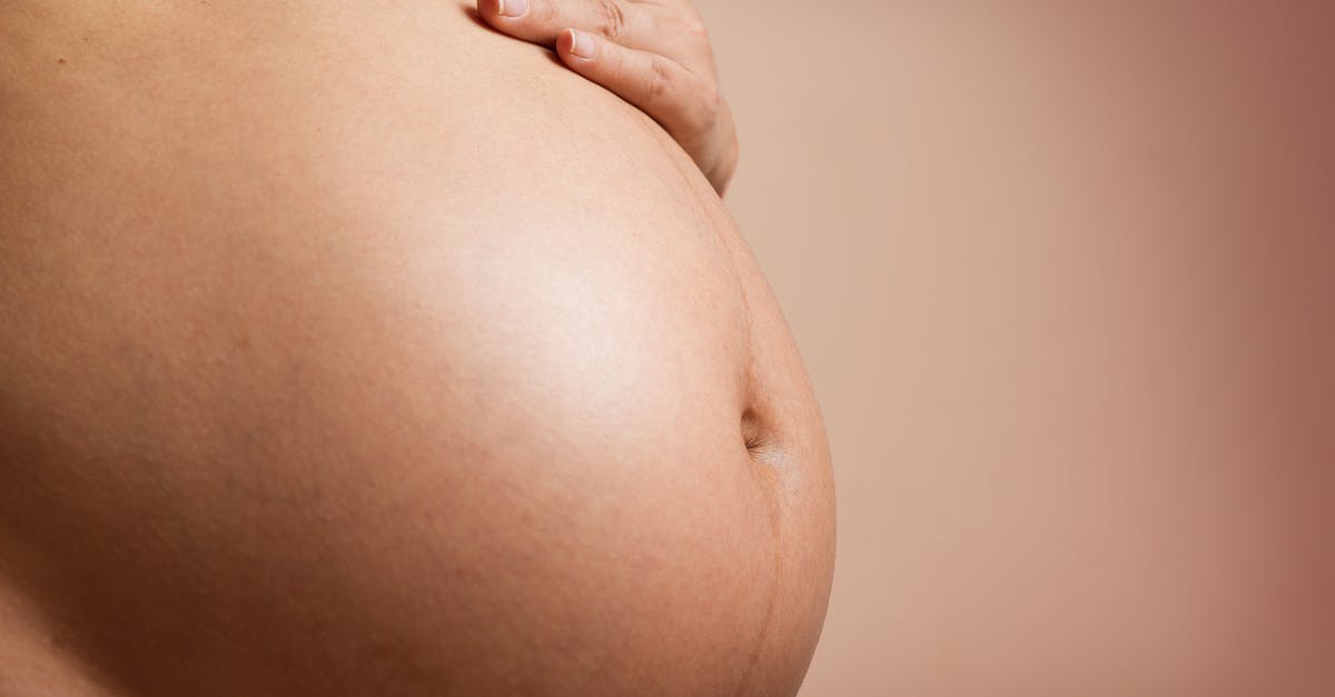 Is a birth certificate enough for a Nexus child application? - Person's Tummy And Hand Is a birth certificate enough for a Nexus child application? - Person's Tummy And Hand