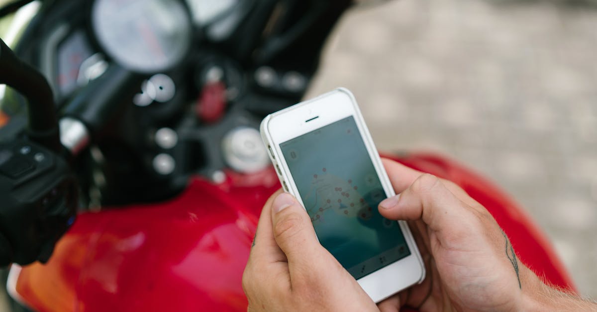 Is a day trip from Naha City to Taketomi Island possible? - Crop tattooed man studying map of city on smartphone Is a day trip from Naha City to Taketomi Island possible? - Crop tattooed man studying map of city on smartphone