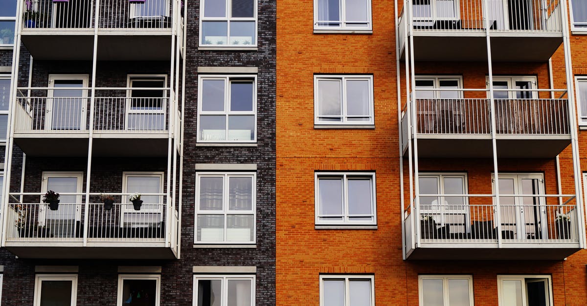 Is a holder of a German unlimited residence permit allowed to work in the UK? [closed] - Photography of Orange and Gray Building