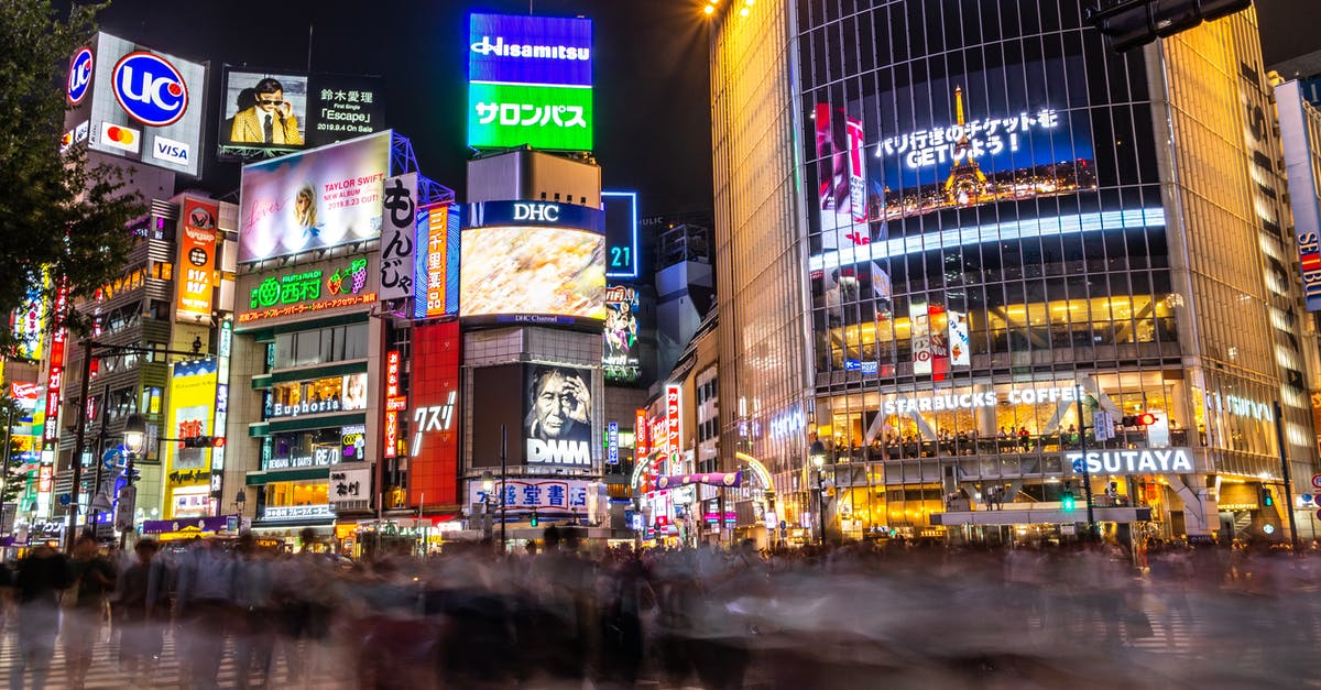 Is a transit visa required at Narita, Japan if you're on a multi city itinerary? - People Walking on Street Near Buildings during Night Time Is a transit visa required at Narita, Japan if you're on a multi city itinerary? - People Walking on Street Near Buildings during Night Time