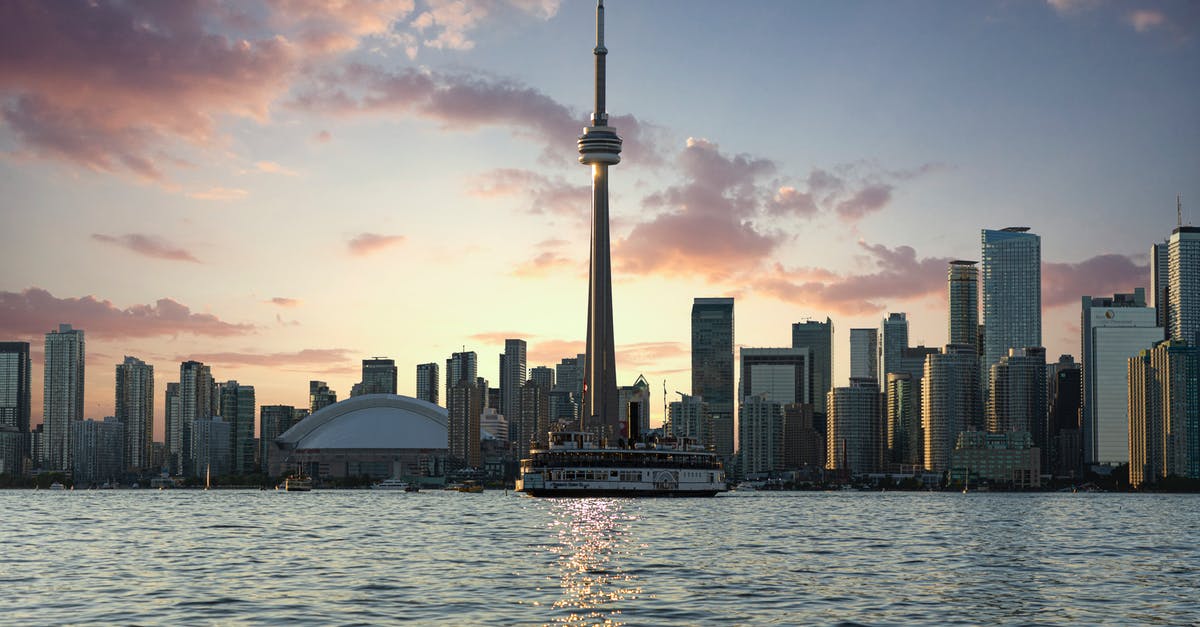 Is a work permit for Canada the same as a visa? [closed] - Photo of CN Tower During Golden Hour