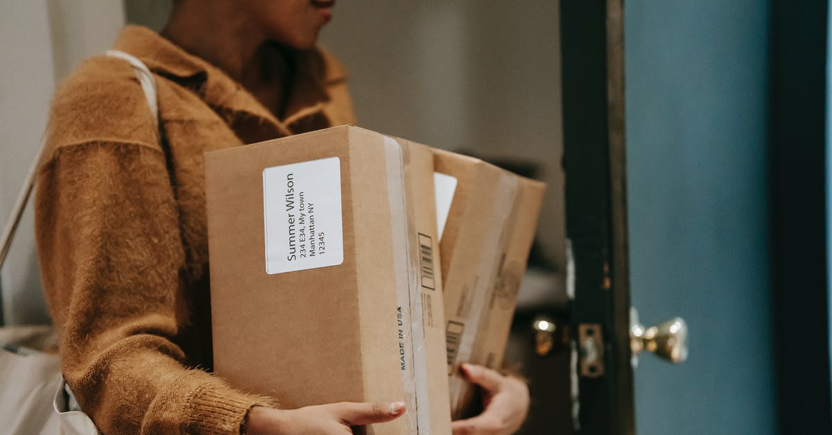Is accommodation address required for a Netherlands study visa? - Crop ethnic female walking into open door of apartment with carton boxes with goods from delivery Is accommodation address required for a Netherlands study visa? - Crop ethnic female walking into open door of apartment with carton boxes with goods from delivery