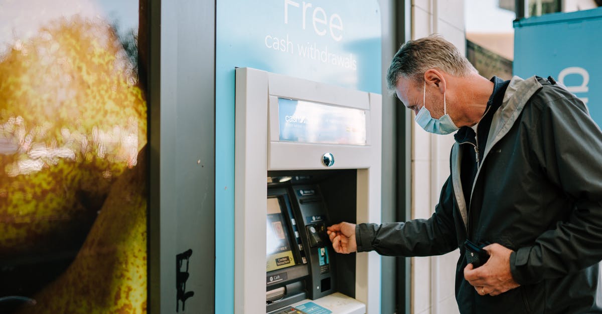 Is Chime a real bank for immigration purposes? - Man Using ATM MachineĀ Is Chime a real bank for immigration purposes? - Man Using ATM MachineĀ