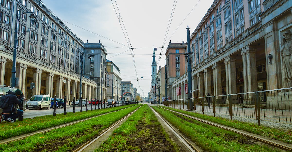 Is Colmar's railway station next to the city center? - Green Grass Between Concrete Buildings Is Colmar's railway station next to the city center? - Green Grass Between Concrete Buildings