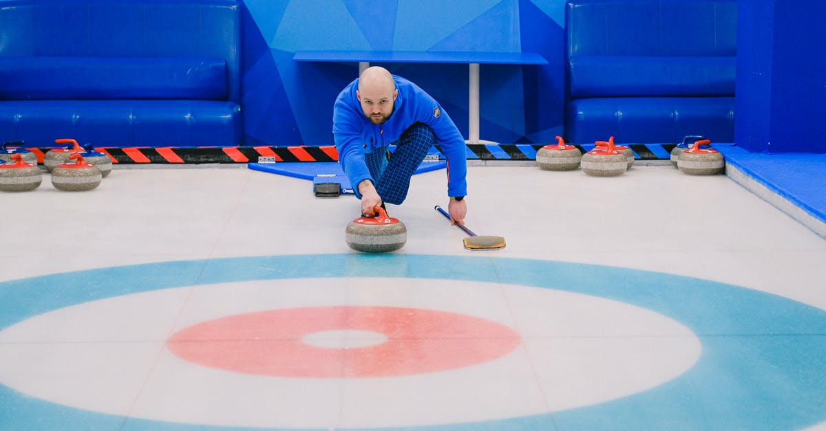 Is complimentary Wi-Fi available on ICE trains outside of Germany? - Focused male in blue activewear choosing tactic and throwing stone while playing curling on ice rink Is complimentary Wi-Fi available on ICE trains outside of Germany? - Focused male in blue activewear choosing tactic and throwing stone while playing curling on ice rink