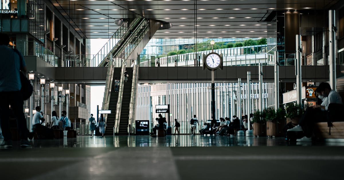 Is eating permitted in La Guardia airport airport nowadays? - People Sitting on Bench Inside Building Is eating permitted in La Guardia airport airport nowadays? - People Sitting on Bench Inside Building
