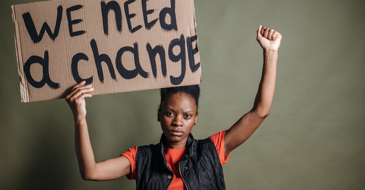 Is ESTA needed with a J-1 Visa? - A Woman Holding a Placard Is ESTA needed with a J-1 Visa? - A Woman Holding a Placard