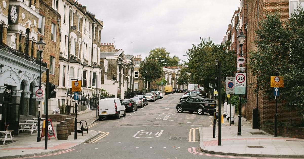 Is EU residence permit still valid for transit through London for a Non-EU citizen(post brexit) [duplicate] - Photo of an Empty Road on a Residential Area