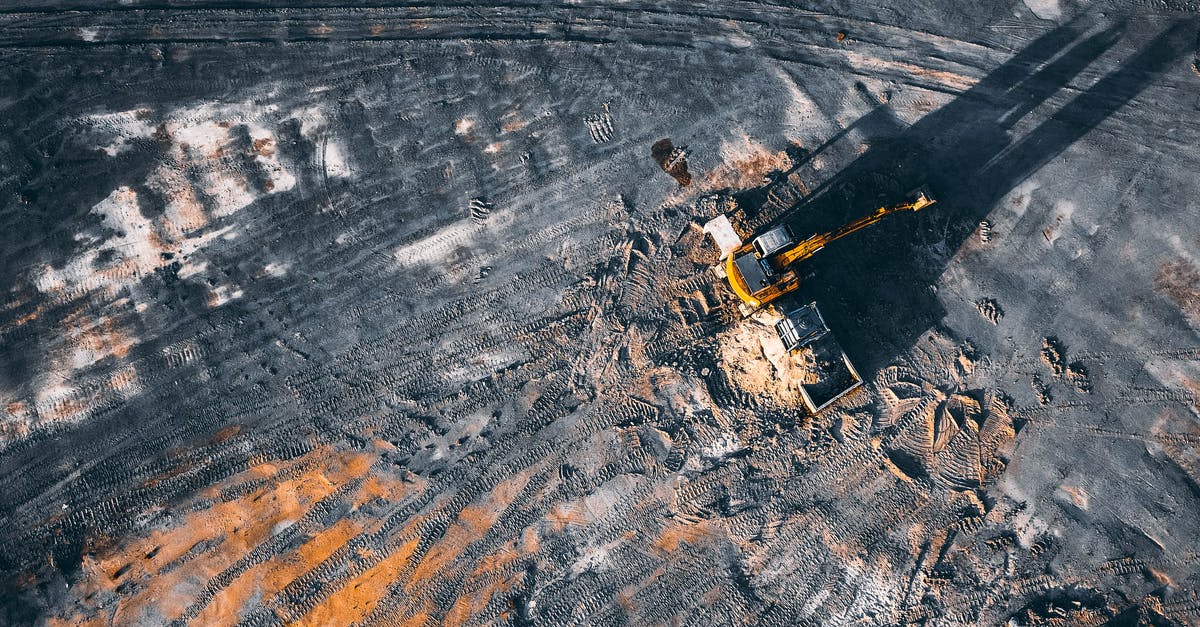 Is fuel dumping a peculiarity of American airlines? - Aerial view of excavator working on big coal field of powerplant located in countryside Is fuel dumping a peculiarity of American airlines? - Aerial view of excavator working on big coal field of powerplant located in countryside