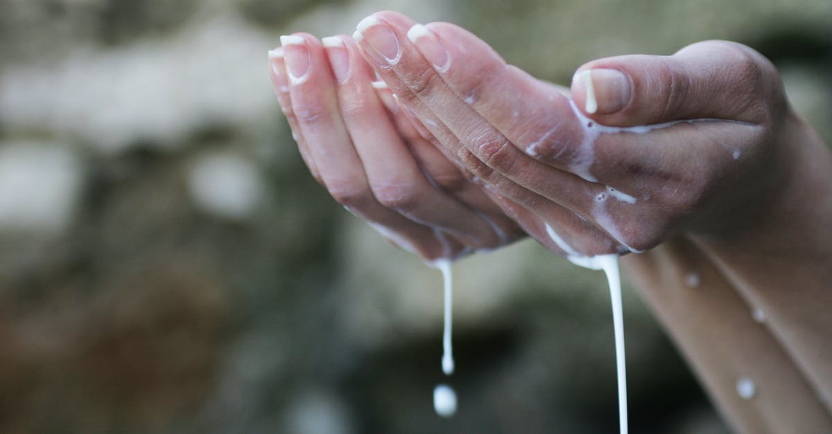 Is it a good idea to use liquid soap to wash dishes when travelling? - Person's Hands Covered in White Liquid Is it a good idea to use liquid soap to wash dishes when travelling? - Person's Hands Covered in White Liquid