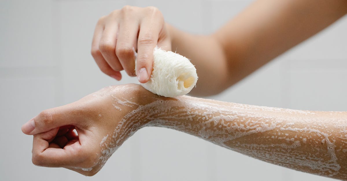 Is it a good idea to use liquid soap to wash dishes when travelling? - Crop anonymous person using wisp washing arms with soap foam during hygienic procedure Is it a good idea to use liquid soap to wash dishes when travelling? - Crop anonymous person using wisp washing arms with soap foam during hygienic procedure