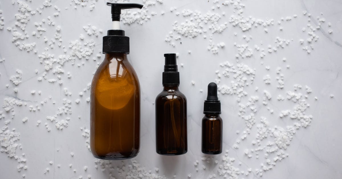 Is it a good idea to use liquid soap to wash dishes when travelling? - Bottles of cosmetic products placed on white surface Is it a good idea to use liquid soap to wash dishes when travelling? - Bottles of cosmetic products placed on white surface