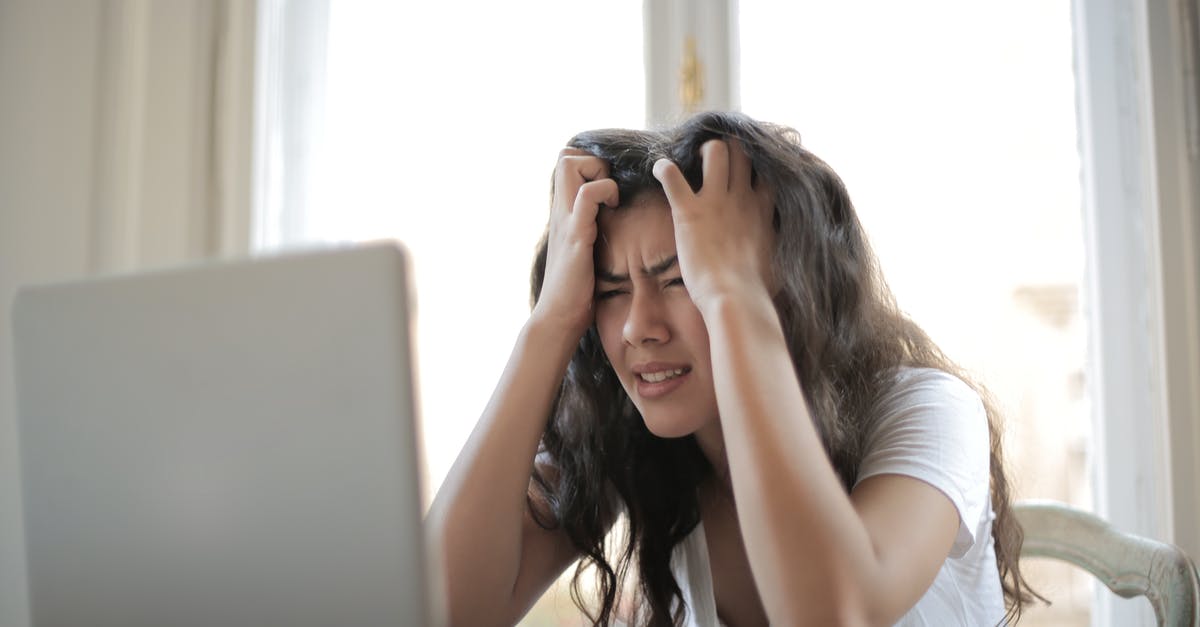 Is it a problem if my laptop is out of battery when I'm asked to switch it on? - Woman in White Shirt Showing Frustration Is it a problem if my laptop is out of battery when I'm asked to switch it on? - Woman in White Shirt Showing Frustration