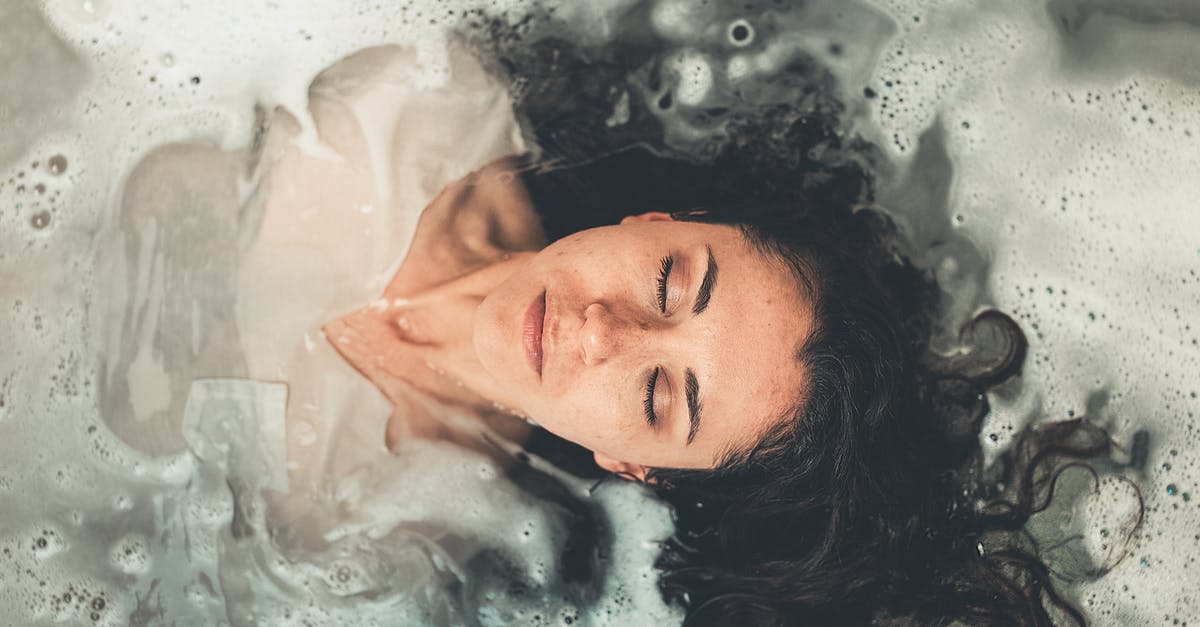 Is it allowed to bathe at Grjótagjá? - Woman in White Dress in Bath Tub