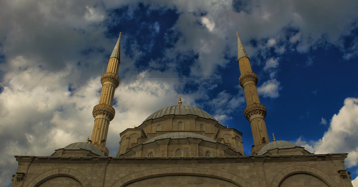 Is it at all possible to visit Old Faithful (Yellowstone) in November? - From below old stone mosque with dome and ornaments against cloudy blue sky on sunny day Is it at all possible to visit Old Faithful (Yellowstone) in November? - From below old stone mosque with dome and ornaments against cloudy blue sky on sunny day