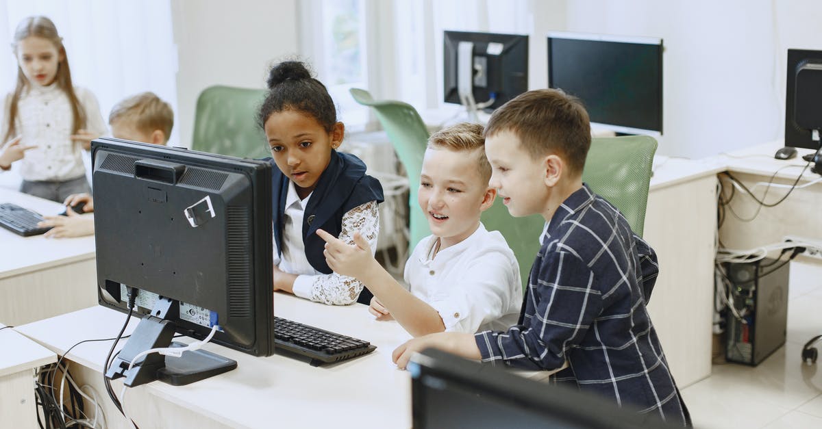 Is it better flying First Class Flex or a cheaper First Class option? [closed] - Children Taking IT Classes Looking at a Computer Screen